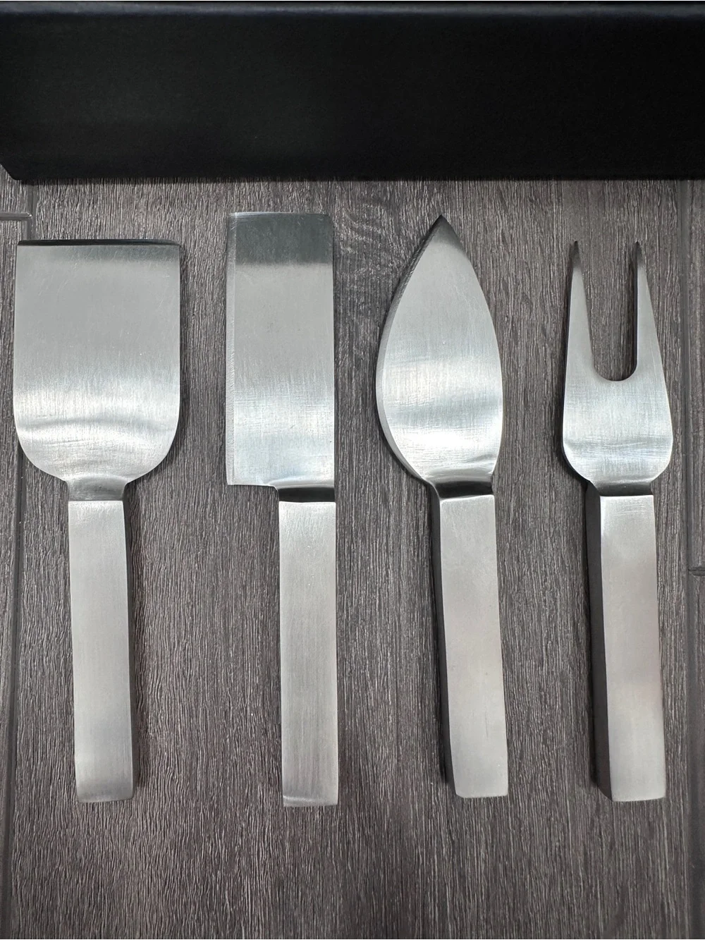 Calvin Klein stainless steel cheese serving set by Calvin Klein Home collection.
